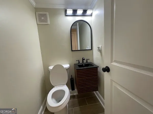 a bathroom with a toilet and a sink