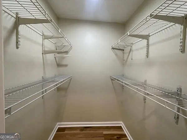 a view of a room with racks on the wall