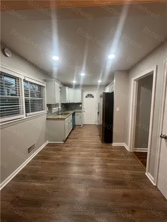 a view of a kitchen with a sink