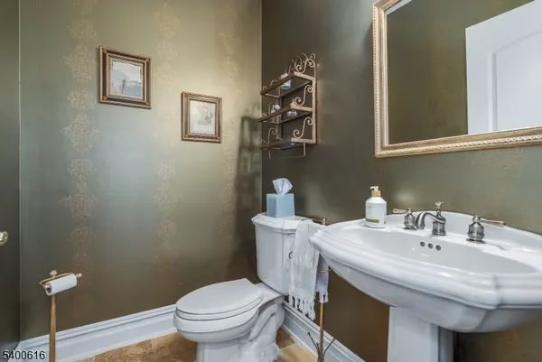 a bathroom with a sink and a toilet