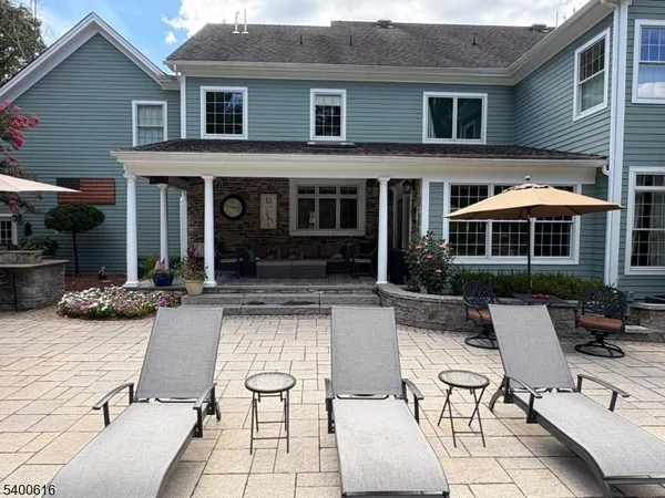 a view of house with outdoor seating space