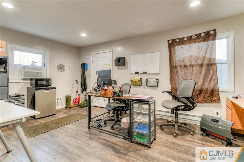 1896 Englishtown Road Old Bridge, NJ 08831 - Photo 11 of 16 a living room with furniture a flat screen tv and a table