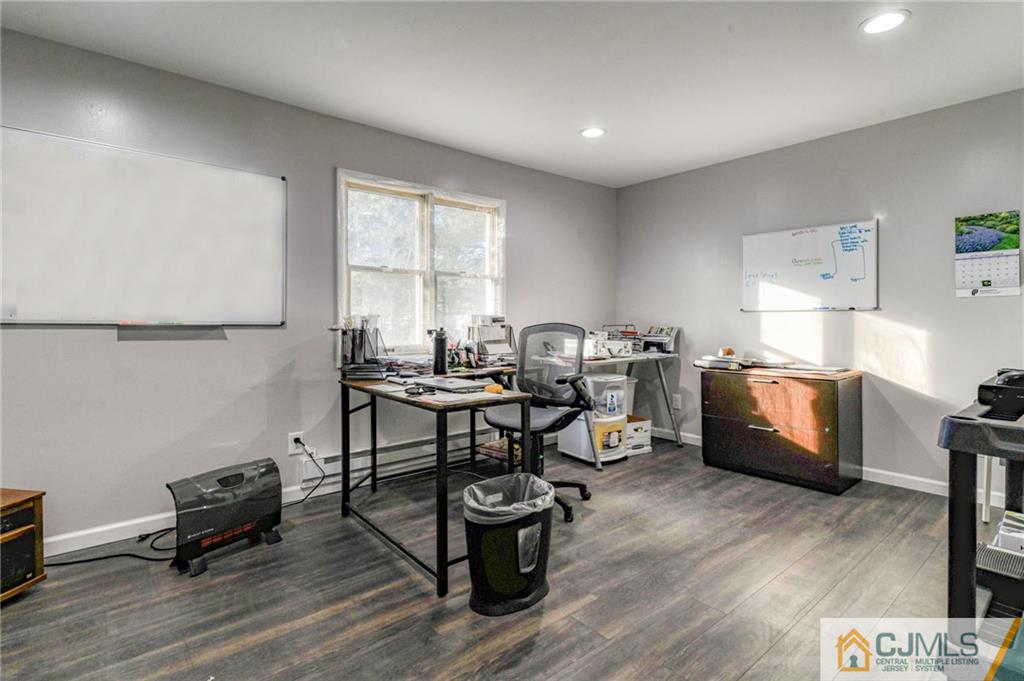 1896 Englishtown Road Old Bridge, NJ 08831 - Photo 13 of 16 a workspace with furniture wooden floor and a window