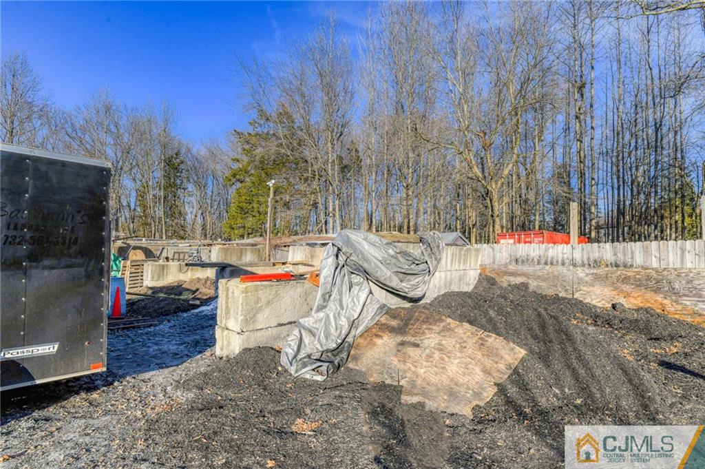 1896 Englishtown Road Old Bridge, NJ 08831 - Photo 15 of 16 a backyard of a house with barbeque oven
