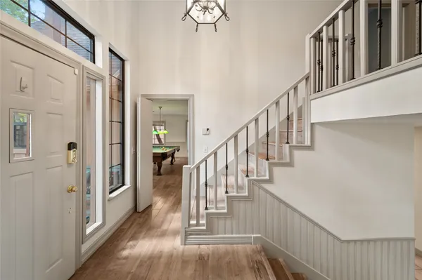 a view of an entryway with wooden floor