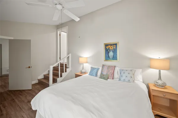 a bedroom with a bed and a lamp