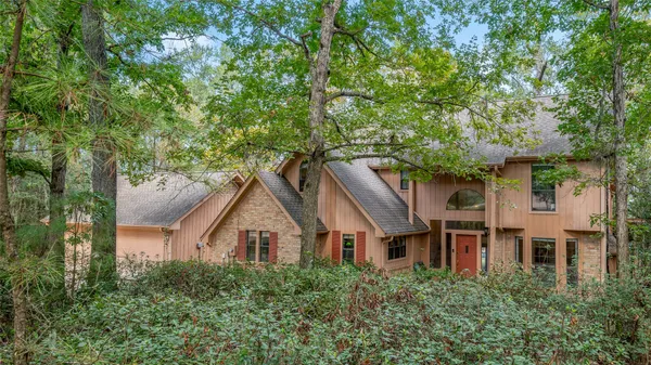 front view of a house with a tree