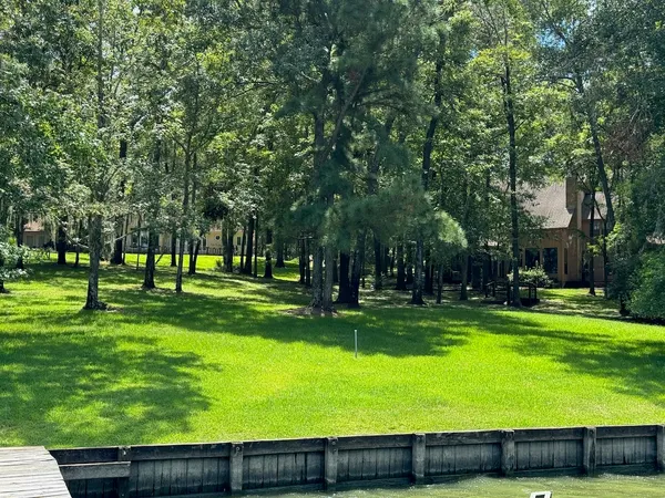 a view of swimming pool with a yard