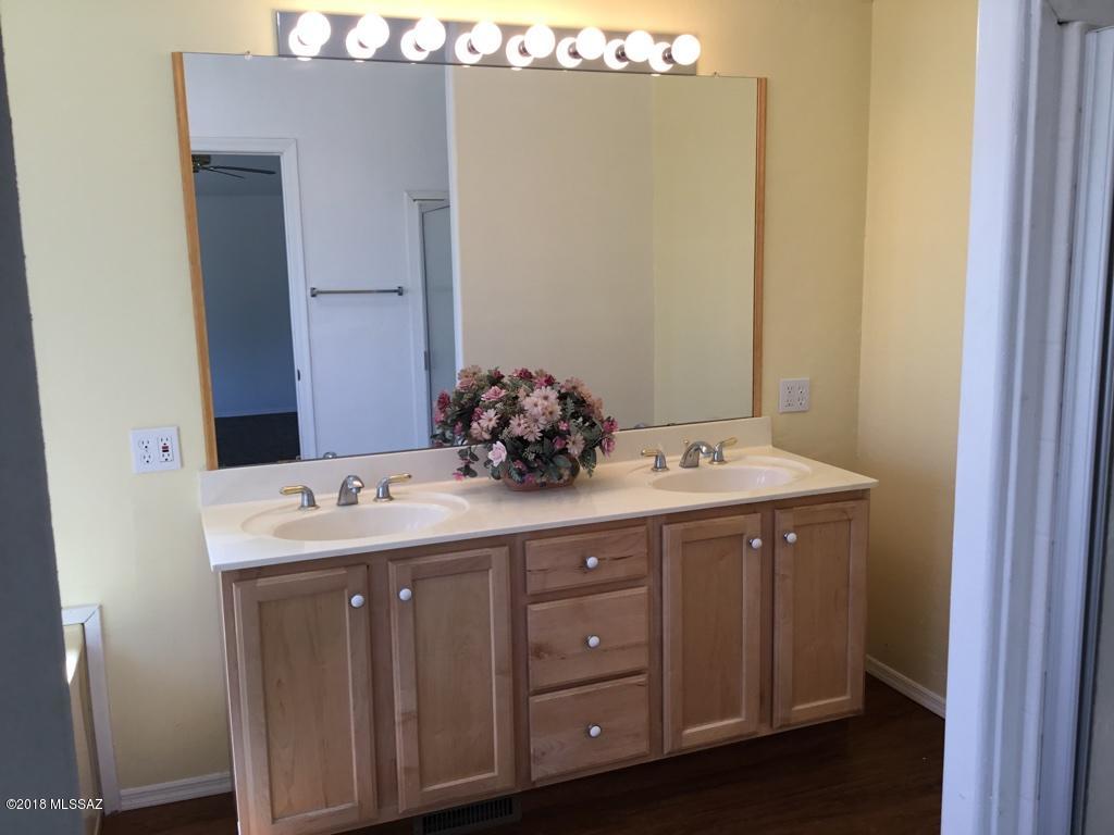 7420 West Bopp Road Tucson, AZ 85735 - Photo 27 of 39 a bathroom with a sink and mirror