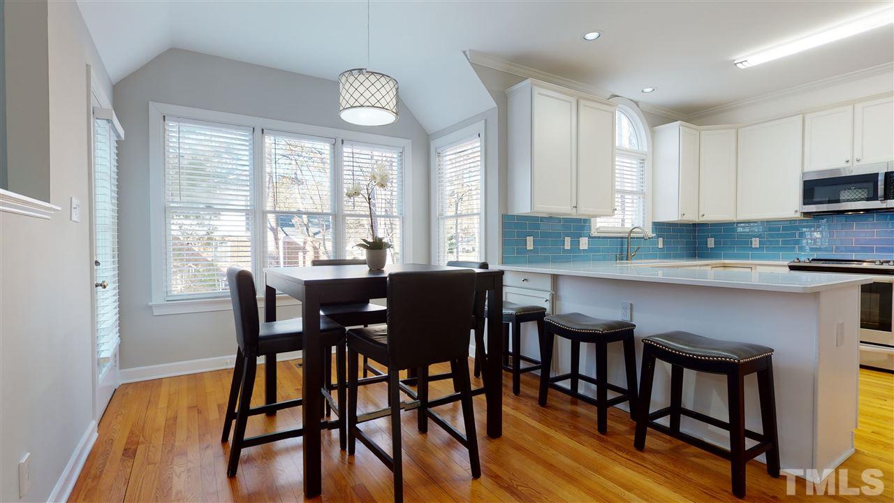 4708 Alistar Court Raleigh, NC 27612 - Photo 12 of 30 a view of a dining room with furniture and a window