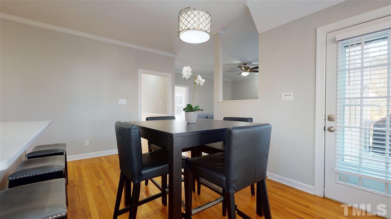 4708 Alistar Court Raleigh, NC 27612 - Photo 16 of 30 a dining room with furniture and window