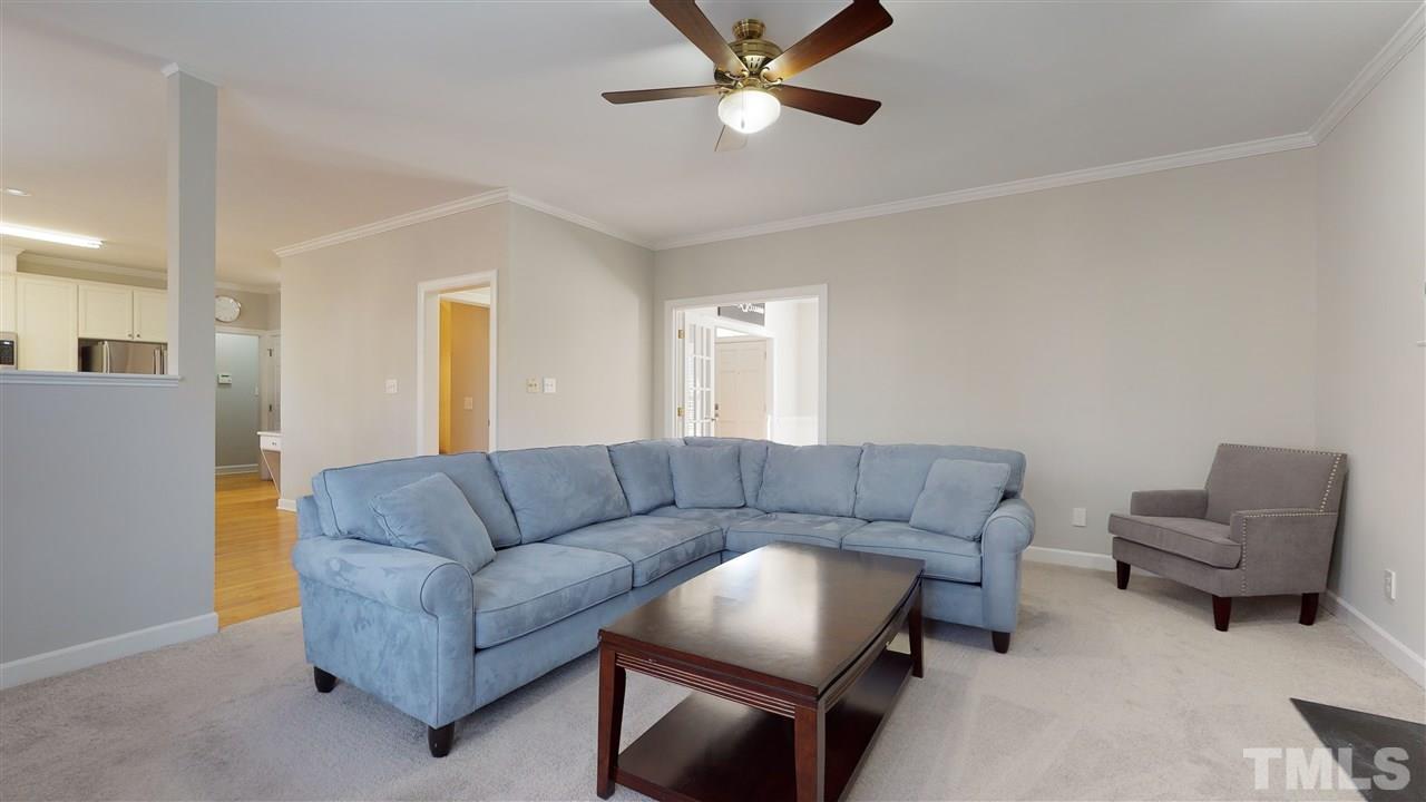 4708 Alistar Court Raleigh, NC 27612 - Photo 9 of 30 a living room with furniture and a couch
