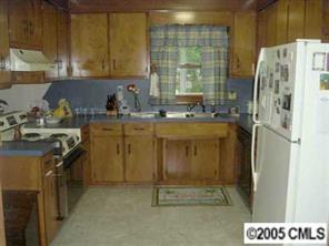 3321 Lake Shore Road South Denver, NC 28037 - Photo 5 of 8 a kitchen with a sink a stove and a refrigerator