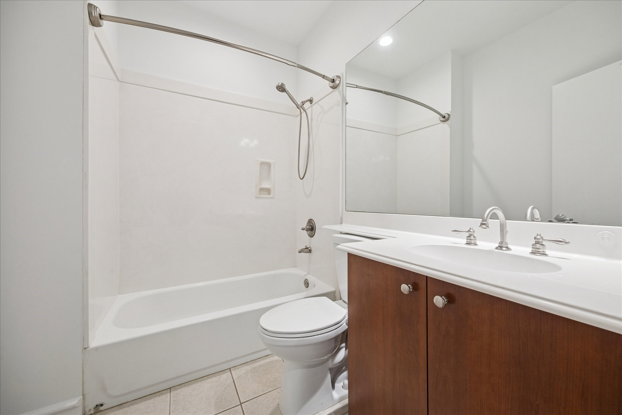3311 Yupon Street, Unit 609 Houston, TX 77006 - Photo 12 of 16 a bathroom with a granite countertop sink toilet and shower