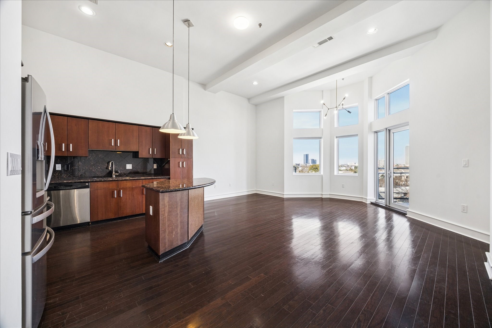 3311 Yupon Street, Unit 609 Houston, TX 77006 - Photo 7 of 16 a view of a kitchen with furniture and wooden floor