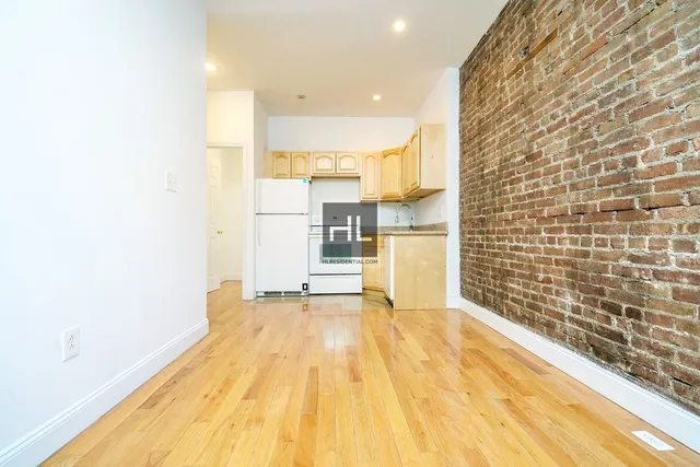 a view of kitchen with wooden floor