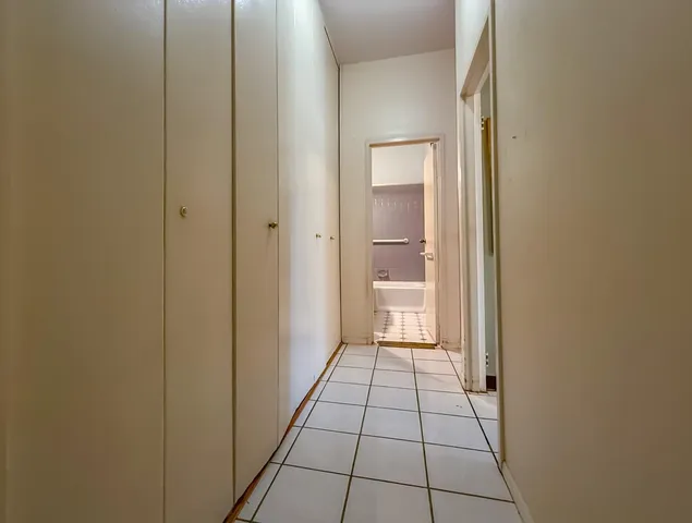 a view of a bathroom from a hallway