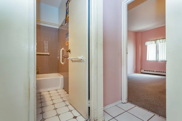 a bathroom with a granite countertop window