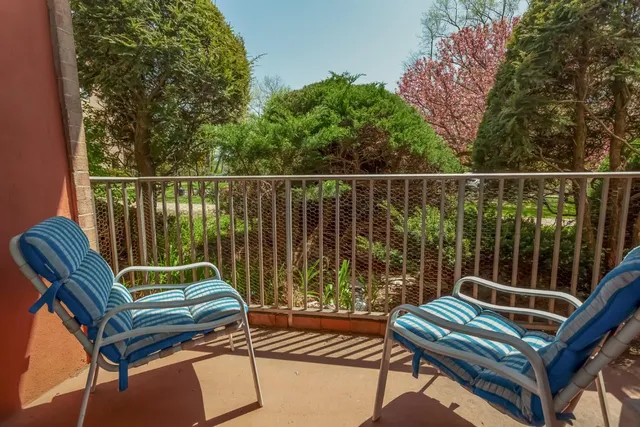 a view of a chairs in wooden deck