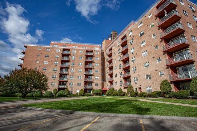 a view of a building with a yard