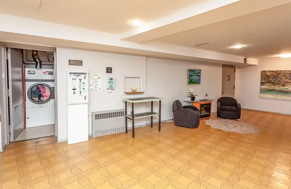 a view of a livingroom with furniture and window
