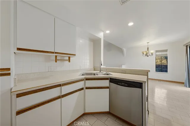 a kitchen with a stove and a sink