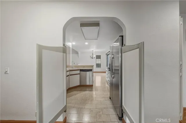 a kitchen with a refrigerator and a sink