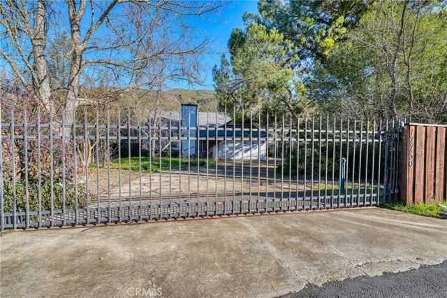 a view of a fence with a small yard