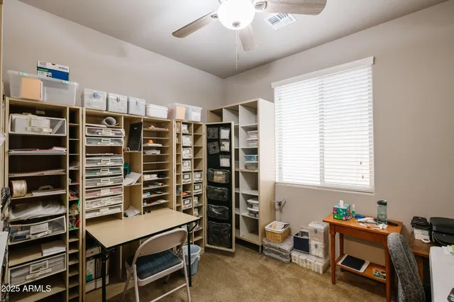 a room with furniture a air conditioner and a window