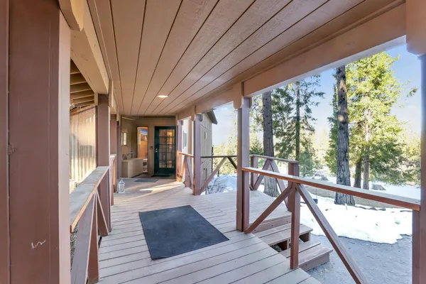 a dining hall with stainless steel appliances granite countertop a stove and a refrigerator