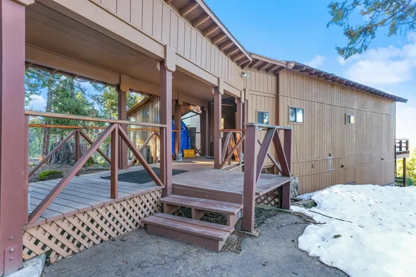 a kitchen with stainless steel appliances a stove a sink and cabinets