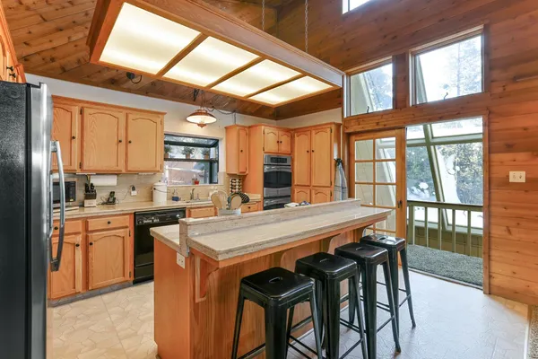 a view of a chairs and table in the patio