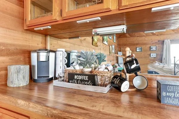 a view of a house with a yard and floor to ceiling window
