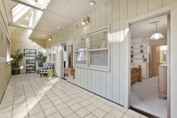 a bedroom with furniture and a window