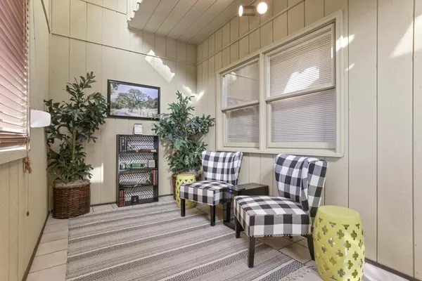 a view of balcony with furniture