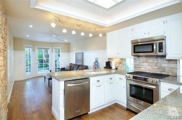 822 Congressional Road Simi Valley, CA 93065 - Photo 14 of 36 a kitchen with stainless steel appliances granite countertop a stove and a sink