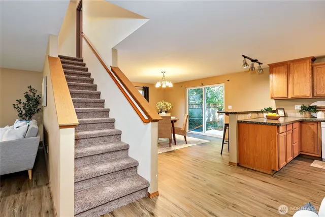 a view of kitchen with furniture and wooden floor