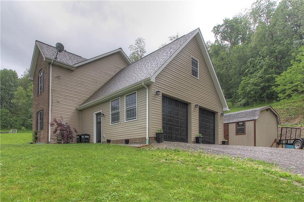 569 Leeper Road Georgetown, PA 15043 - Photo 3 of 25 HEATED spacious two car garage. Large detached shed.