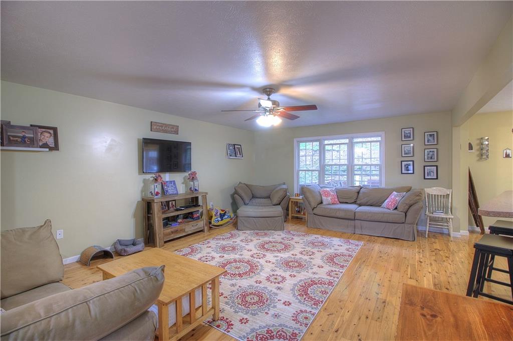 569 Leeper Road Georgetown, PA 15043 - Photo 4 of 25 Large cozy living room with open floor plan to the dining/kitchen.