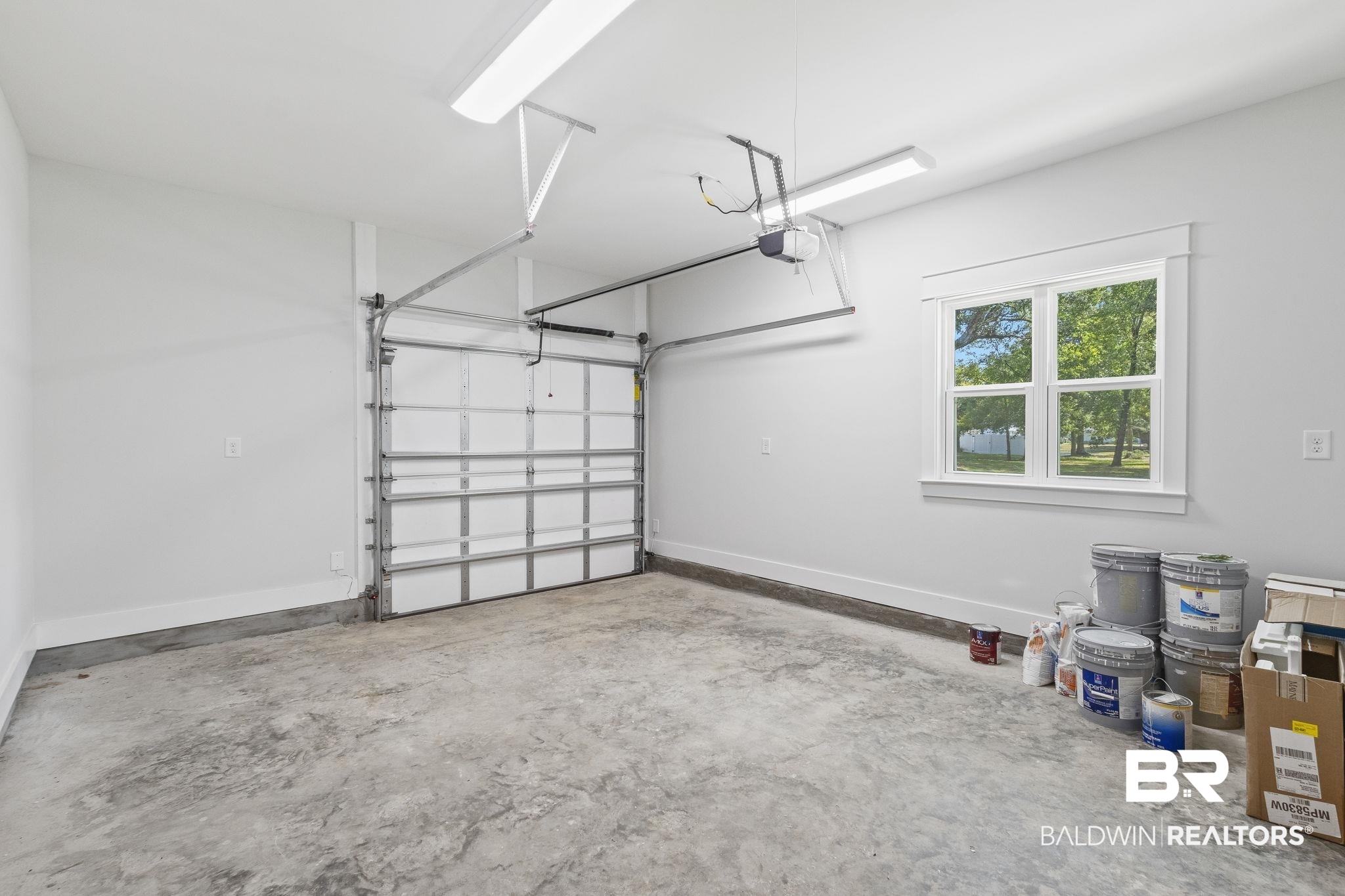 12130 Reunion Place Foley, AL 36535 - Photo 29 of 42 Garage with a garage door opener