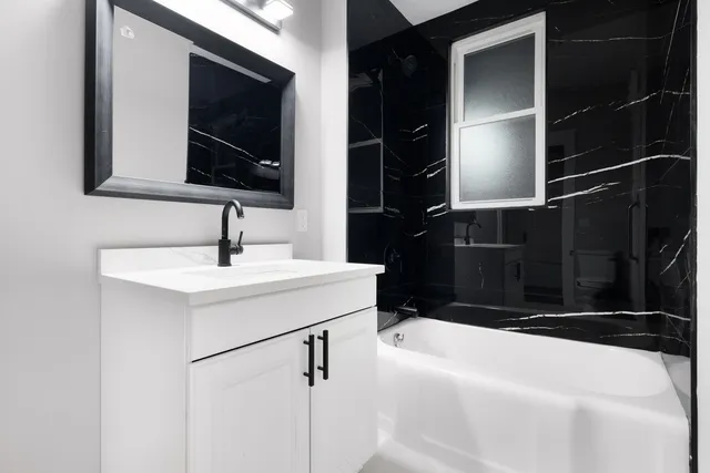 a bathroom with a sink and a mirror