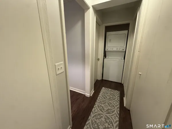 a view of hallway with wooden floor