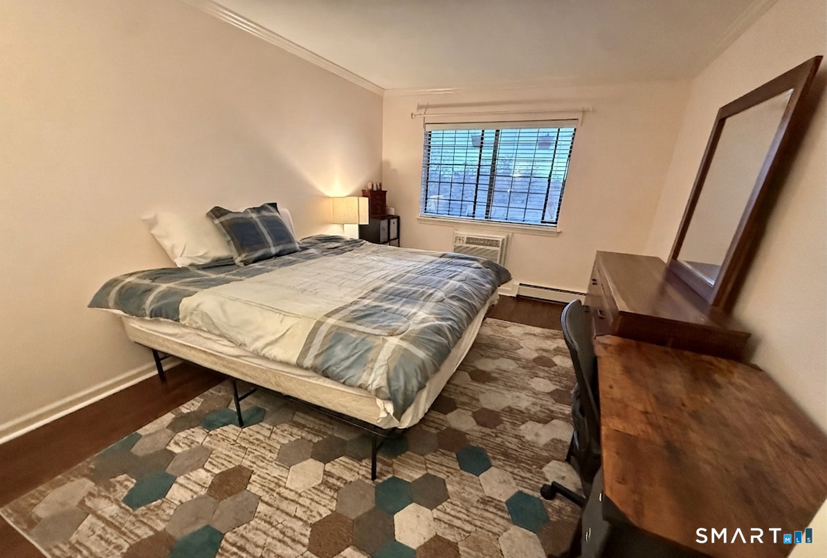125 Warner Hill Road, Unit 67 Stratford, CT 06614 - Photo 8 of 14 The primary bedroom is your personal sanctuary-a serene escape where comfort and calm embrace you the moment you step inside.