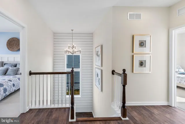 a view of bedroom with furniture and wooden floor