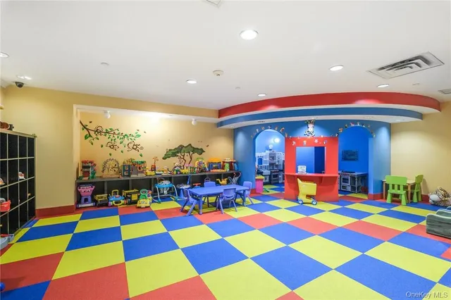 a room with lots of windows and fan