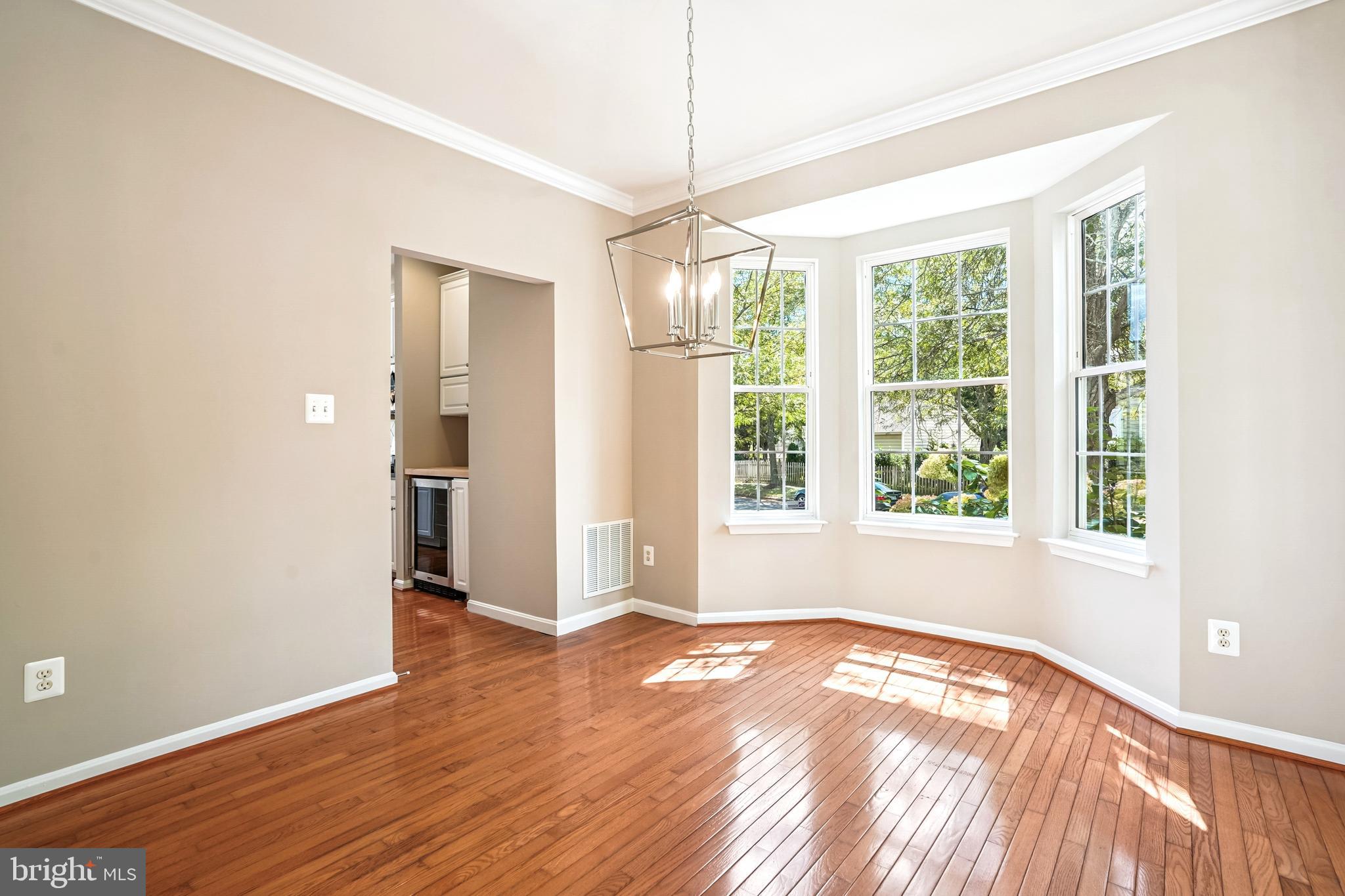26096 Flintonbridge Drive Chantilly, VA 20152 - Photo 8 of 69 a view of empty room with wooden floor and fan
