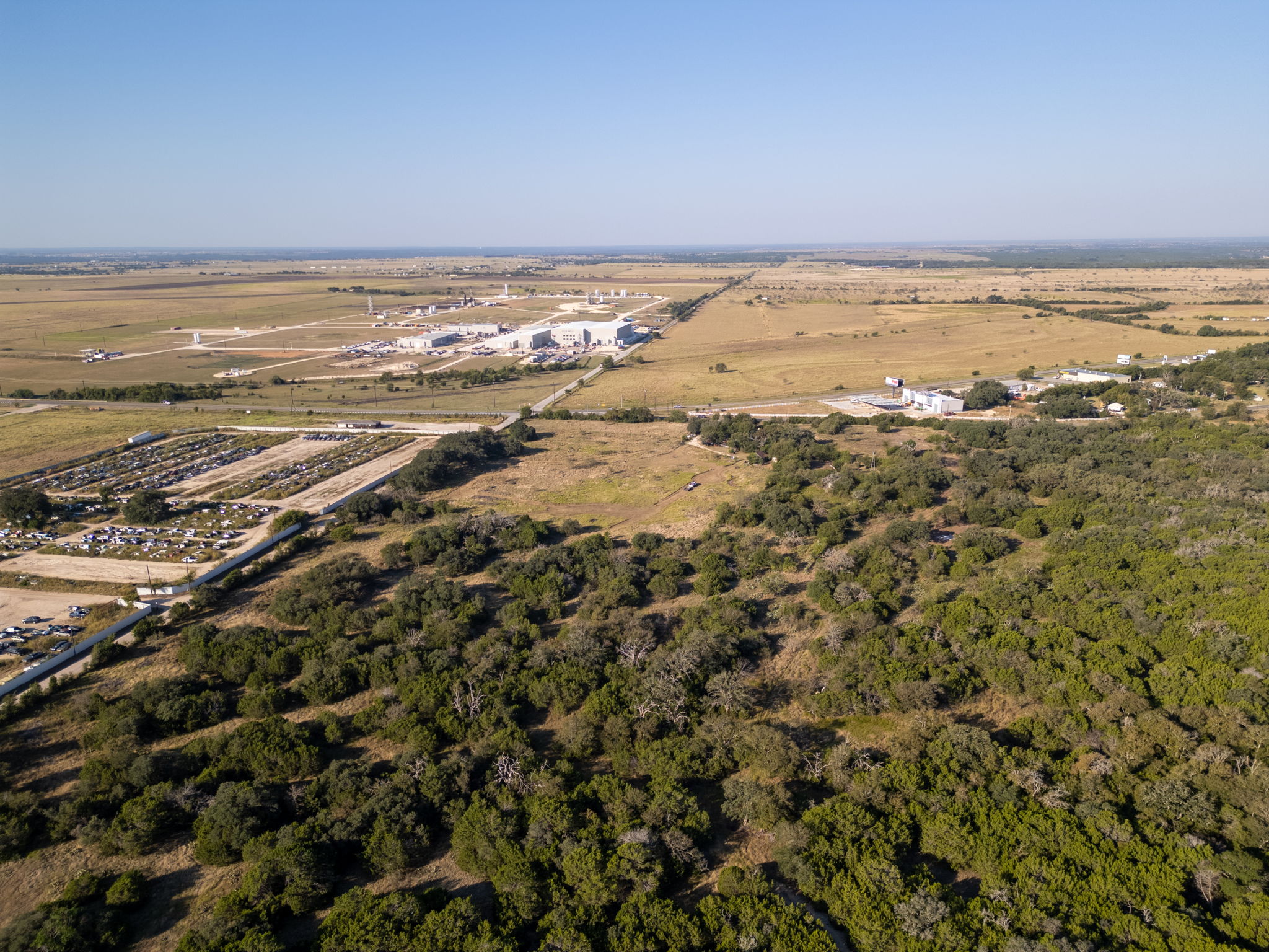 112 Loop 308 Briggs, TX 78608 - Photo 10 of 37 View of property location featuring a forest