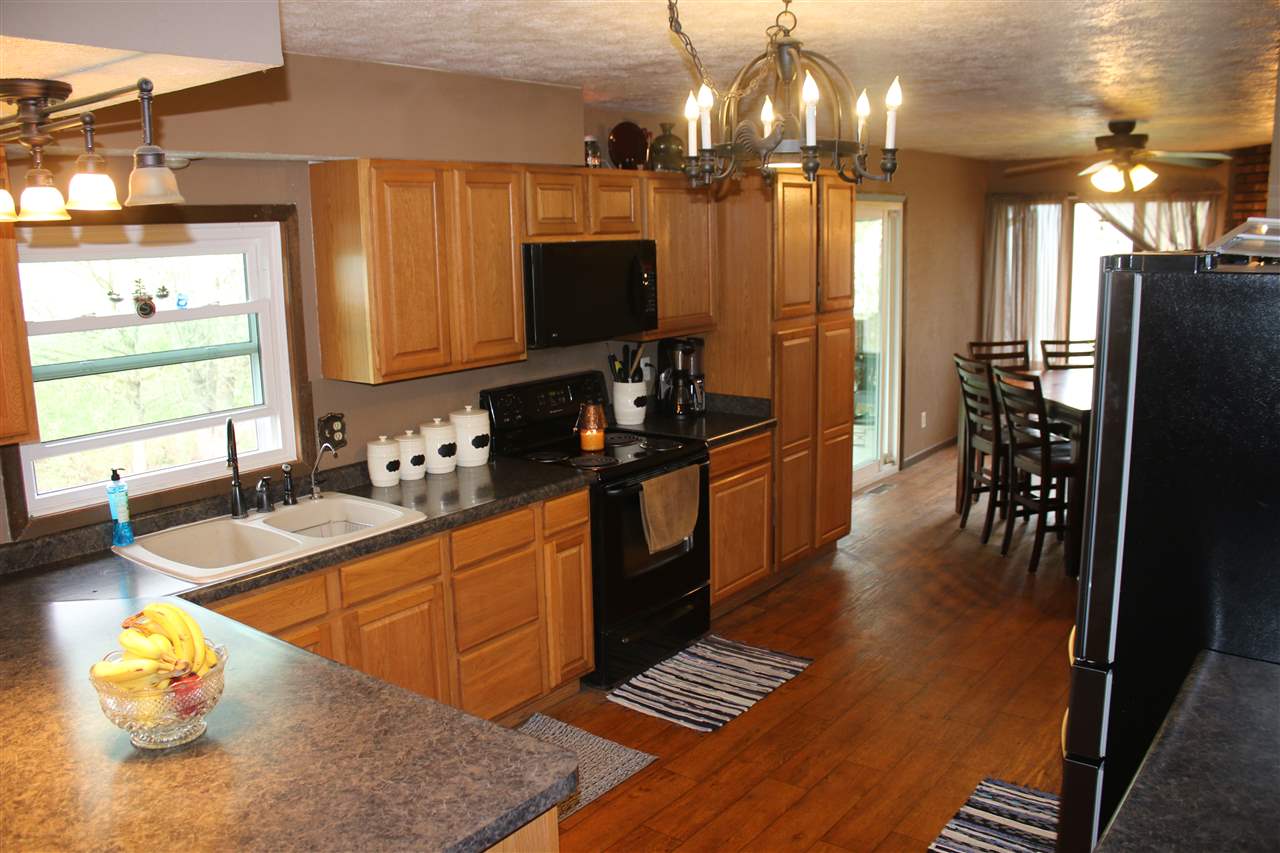 4484 East Walden Road Byron, IL 61010 - Photo 8 of 22 a kitchen with stainless steel appliances a sink stove and refrigerator