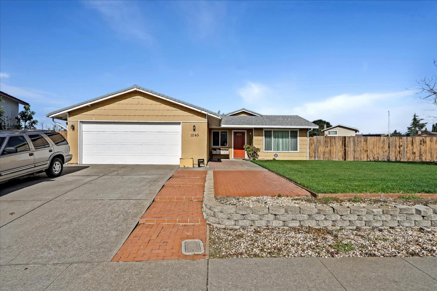 1045 Seascape Circle Rodeo, CA 94572 - Photo 1 of 6 a front view of a house with a yard and garage