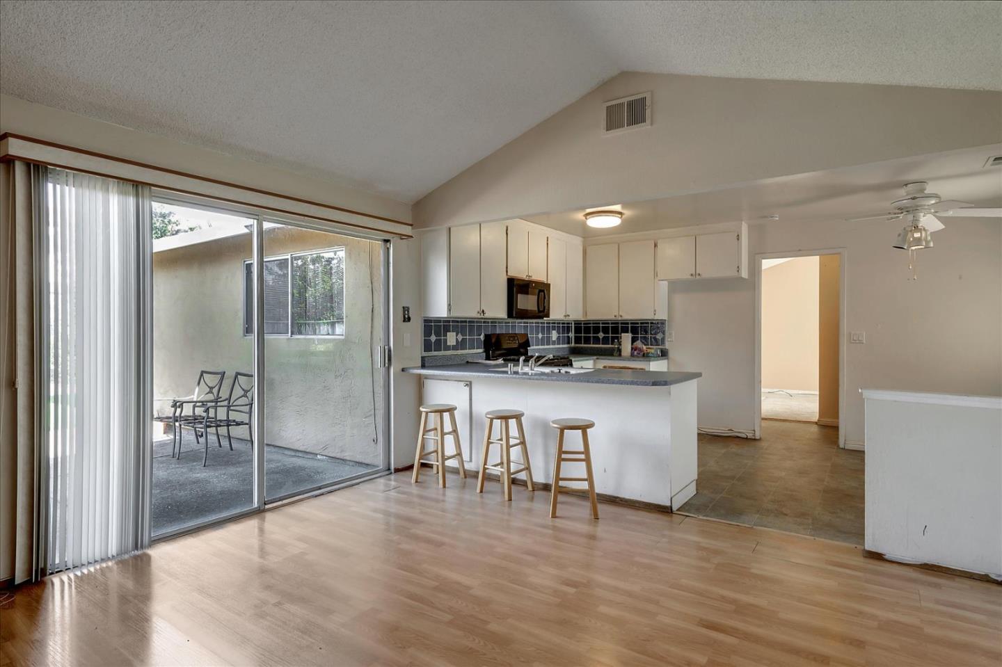 1045 Seascape Circle Rodeo, CA 94572 - Photo 5 of 6 a kitchen with stainless steel appliances granite countertop a refrigerator and a stove top oven